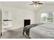 Bedroom features neutral carpet, vaulted ceiling, ceiling fan, and large closet at 10758 Gettysburg Pl, Carmel, IN 46032
