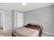 Inviting bedroom with carpeted floors, neutral walls, and a large bed with a brown comforter at 10758 Gettysburg Pl, Carmel, IN 46032