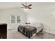 Bedroom with neutral carpet, vaulted ceiling, ceiling fan, and window with blinds at 10758 Gettysburg Pl, Carmel, IN 46032