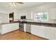Bright kitchen featuring white cabinets, granite countertops, stainless steel appliances, and a spacious layout at 10758 Gettysburg Pl, Carmel, IN 46032