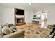 A spacious living room features a fireplace, hardwood flooring and an eat-in kitchen at 10758 Gettysburg Pl, Carmel, IN 46032