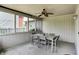Enclosed patio features a dining table, chairs, and an overhead ceiling fan at 10758 Gettysburg Pl, Carmel, IN 46032