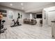 Finished basement with living and exercise areas with bar seating at 12505 Branford St, Carmel, IN 46032