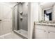 Bathroom featuring a glass-enclosed shower and granite countertops at 12505 Branford St, Carmel, IN 46032