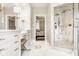 Bright bathroom featuring marble walk-in shower and a vanity with makeup station at 12505 Branford St, Carmel, IN 46032