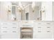 Luxury bathroom with dual vanities, marble countertops, and elegant lighting fixtures at 12505 Branford St, Carmel, IN 46032