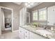 Bathroom featuring double sink vanity with granite counters at 12505 Branford St, Carmel, IN 46032