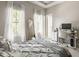 Bright bedroom with two windows and a workspace featuring an ergonomic chair at 12505 Branford St, Carmel, IN 46032