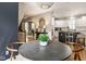 This dining area offers views of the entryway, kitchen, and an eye-catching overhead light fixture at 12505 Branford St, Carmel, IN 46032