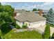 Aerial shot highlighting the home's manicured lawn, fenced backyard, and convenient three-car garage at 12505 Branford St, Carmel, IN 46032