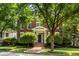 Charming brick two-story home with a well-manicured lawn and lush landscaping, creating an inviting curb appeal at 12505 Branford St, Carmel, IN 46032
