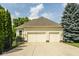 Spacious three-car garage with a wide driveway, set in a well-kept and fenced yard at 12505 Branford St, Carmel, IN 46032
