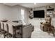 Cozy living room with custom built-ins, recessed lighting and wood floors with modern furniture at 12505 Branford St, Carmel, IN 46032