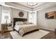 Luxurious main bedroom featuring a king-sized bed, decorative wall art and modern lighting at 12505 Branford St, Carmel, IN 46032