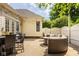 Outdoor patio with comfortable seating, dining area, and cafe lighting at 12505 Branford St, Carmel, IN 46032