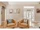Inviting sitting area with modern artwork and comfortable armchairs, perfect for relaxation at 12505 Branford St, Carmel, IN 46032