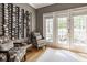 Stylish wine room with a custom wine rack, comfortable seating, and natural light at 12505 Branford St, Carmel, IN 46032