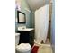 Cozy bathroom featuring a corner shower, vanity with sink, and a toilet at 1358 Hiatt St, Indianapolis, IN 46221