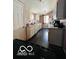 View of the kitchen with classic cabinets and a dark countertop on one side at 1358 Hiatt St, Indianapolis, IN 46221