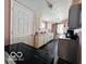 View of the kitchen with classic cabinets and a dark countertop on one side at 1358 Hiatt St, Indianapolis, IN 46221