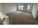 Bonus room featuring plush carpet, natural light and ample space at 13646 Grand Abbey Way, Fishers, IN 46037