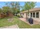 A well-manicured backyard with patio, lawn, and storage shed visible at 1415 Section St, Plainfield, IN 46168
