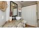 Bathroom featuring a decorative vessel sink, framed mirror, and shower with curtain at 1415 Section St, Plainfield, IN 46168