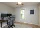 Office space featuring wood floors, grey walls and a ceiling fan at 1415 Section St, Plainfield, IN 46168