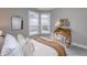 Cozy bedroom with a comfortable bed, a wooden desk by a window, and stylish decor at 14892 Higgins Dr, Westfield, IN 46074