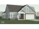 Charming home with a stone front, light blue siding, and a two-car garage at 14892 Higgins Dr, Westfield, IN 46074