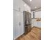 Modern kitchen with stainless steel appliances, white cabinets, and a refrigerator at 14892 Higgins Dr, Westfield, IN 46074