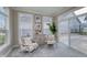 Inviting sunroom with comfortable seating, large windows, and natural light, creating a serene atmosphere at 14892 Higgins Dr, Westfield, IN 46074