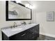 Bright bathroom features a dual sink vanity, marble countertop, and stylish fixtures at 1531 English Ave, Indianapolis, IN 46201