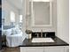Bathroom featuring a modern vanity with dark countertop and view into the bedroom at 1531 English Ave, Indianapolis, IN 46201
