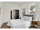 Bright bedroom with natural light, neutral decor, and access to an en-suite bathroom at 1531 English Ave, Indianapolis, IN 46201