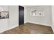 Bedroom featuring wood flooring and a window with natural light at 1531 English Ave, Indianapolis, IN 46201