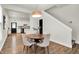 Bright dining area featuring a modern light fixture, and an open concept layout at 1531 English Ave, Indianapolis, IN 46201