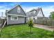 Charming home featuring new siding, a manicured lawn and mature landscaping at 1531 English Ave, Indianapolis, IN 46201