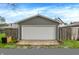Detached garage with a large white door and concrete pad at 1531 English Ave, Indianapolis, IN 46201