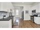 Modern kitchen with white cabinetry, stainless steel appliances, and open layout at 1531 English Ave, Indianapolis, IN 46201