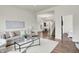 Open-concept living room boasting hardwood floors and neutral color palette at 1531 English Ave, Indianapolis, IN 46201
