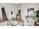 Bright living room featuring hardwood floors, stylish furniture, and natural light at 1531 English Ave, Indianapolis, IN 46201