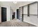 Main bedroom featuring built-in shelving and closet space with neutral colored carpet at 1531 English Ave, Indianapolis, IN 46201