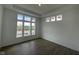 Bright bedroom with dark floors, ample natural light from the large window at 15352 Cardonia Rd, Fishers, IN 46037