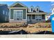 Charming new construction home with green siding, white trim, and brick accents at 15352 Cardonia Rd, Fishers, IN 46037