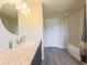 Modern bathroom featuring a granite countertop, brushed nickel faucet, and a tub with shower at 15460 Follow Dr, Noblesville, IN 46060