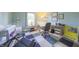 room featuring colorful carpet, a crib, a drawing table, and a window with a view at 15460 Follow Dr, Noblesville, IN 46060