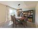 Inviting dining room with natural light, a large table, and built-in bookshelves at 15460 Follow Dr, Noblesville, IN 46060