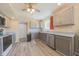 The bright kitchen has stainless steel appliances, ample cabinets, and wood-look floors at 15460 Follow Dr, Noblesville, IN 46060