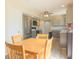This bright kitchen and breakfast nook features stainless appliances and wood-look floors at 15460 Follow Dr, Noblesville, IN 46060